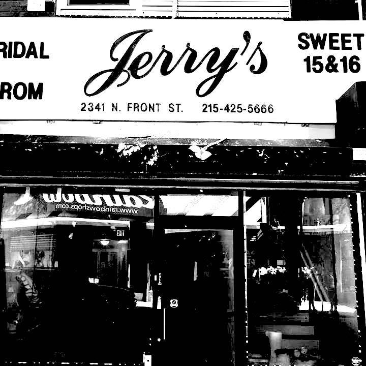 high contrast photo of Jerry's on Front storefront window as viewed from the sidewalk